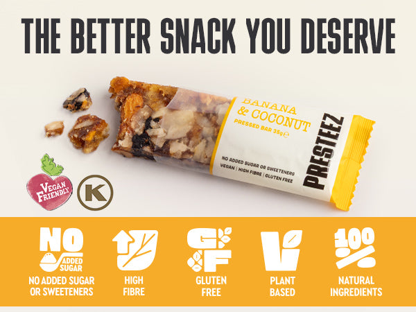 A packaged pressed snack bar labeled 'PRESTEEZ' and 'BANANA & COCONUT' shown on a light background with large marketing text at the top and feature icons along the bottom. The product itself is a clear wrapper around a tan and brown snack bar with visible banana and coconut pieces, plus yellow packaging accents.