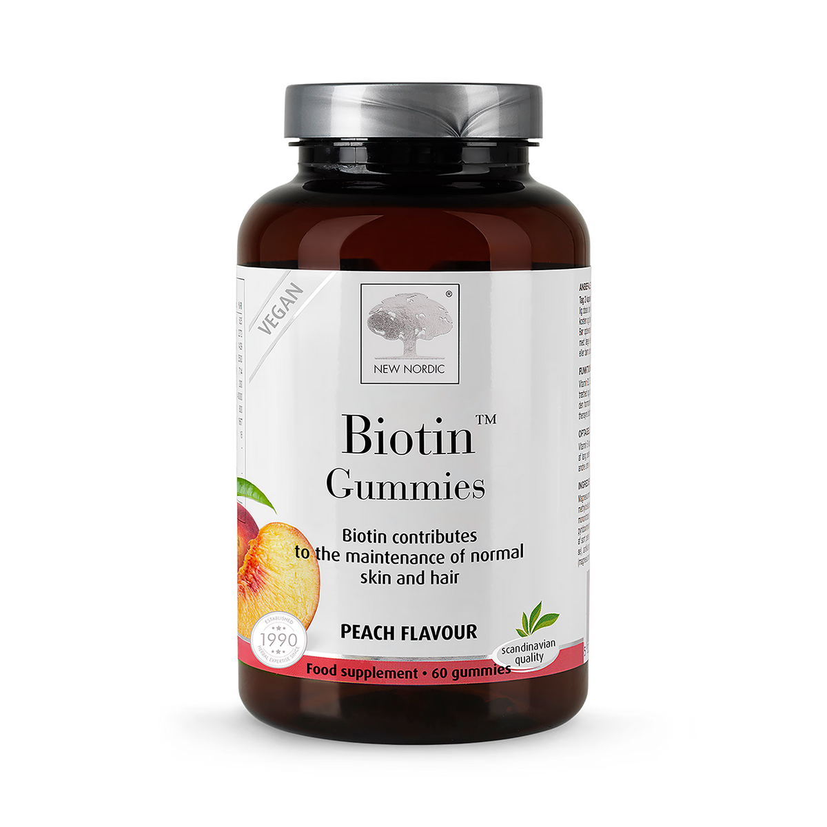 Bottle of New Nordic Biotin Gummies with peach flavor on a white background
