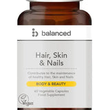 Supplement bottle labeled 'Hair, Skin & Nails' by the brand 'balanced' on a white background.