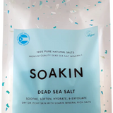 Package of Soakin Dead Sea Salt with branding and product description on a light speckled background