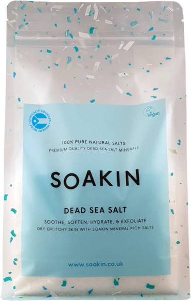 Package of Soakin Dead Sea Salt with branding and product description on a light speckled background