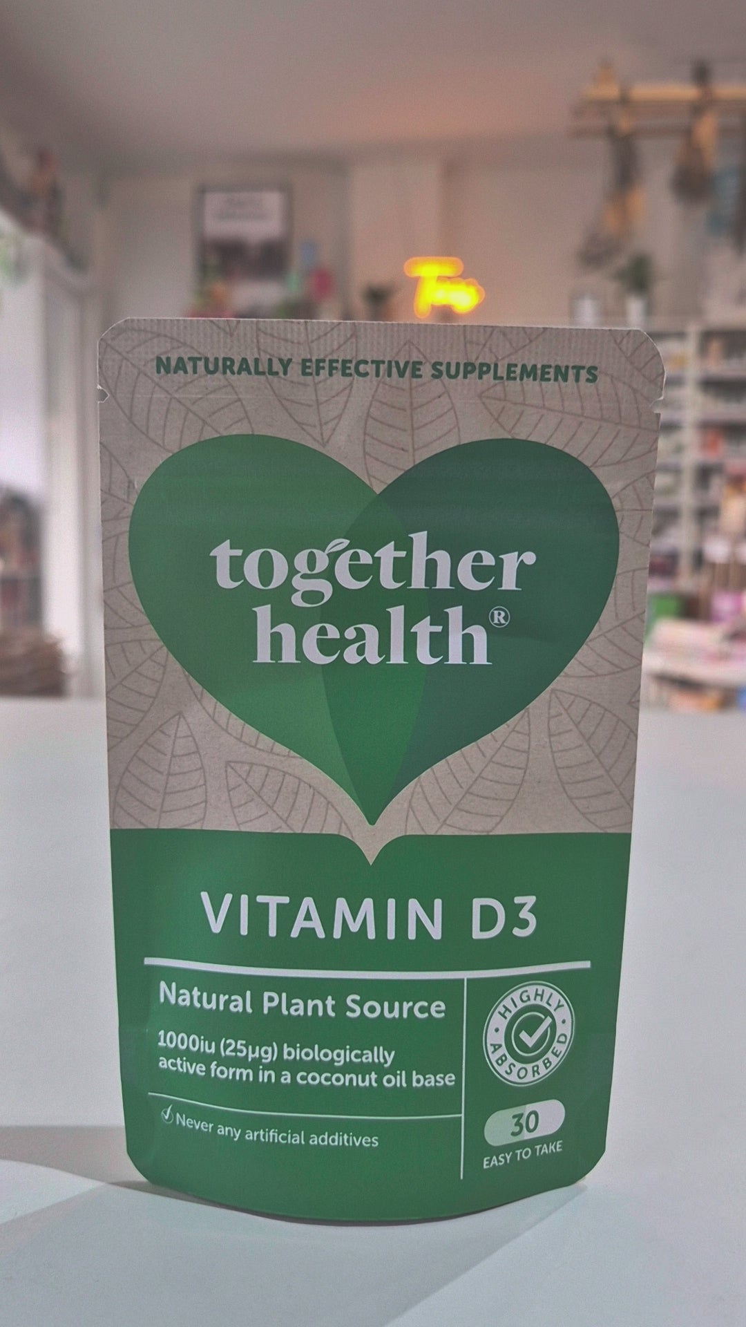 Together Health Vitamin D3 supplement package in a shop background as a video