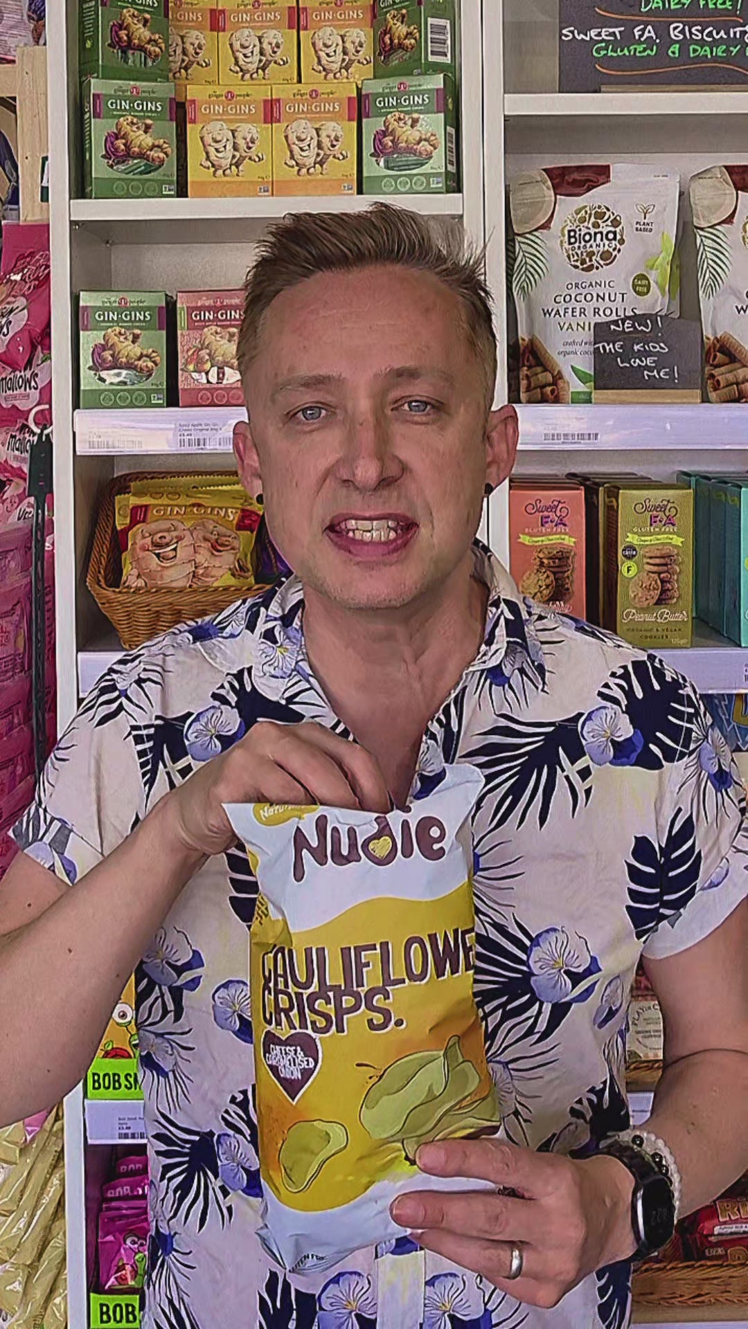 Packaged cauliflower chips cheese and caramelised onion with 'Nudie' branding in a store setting