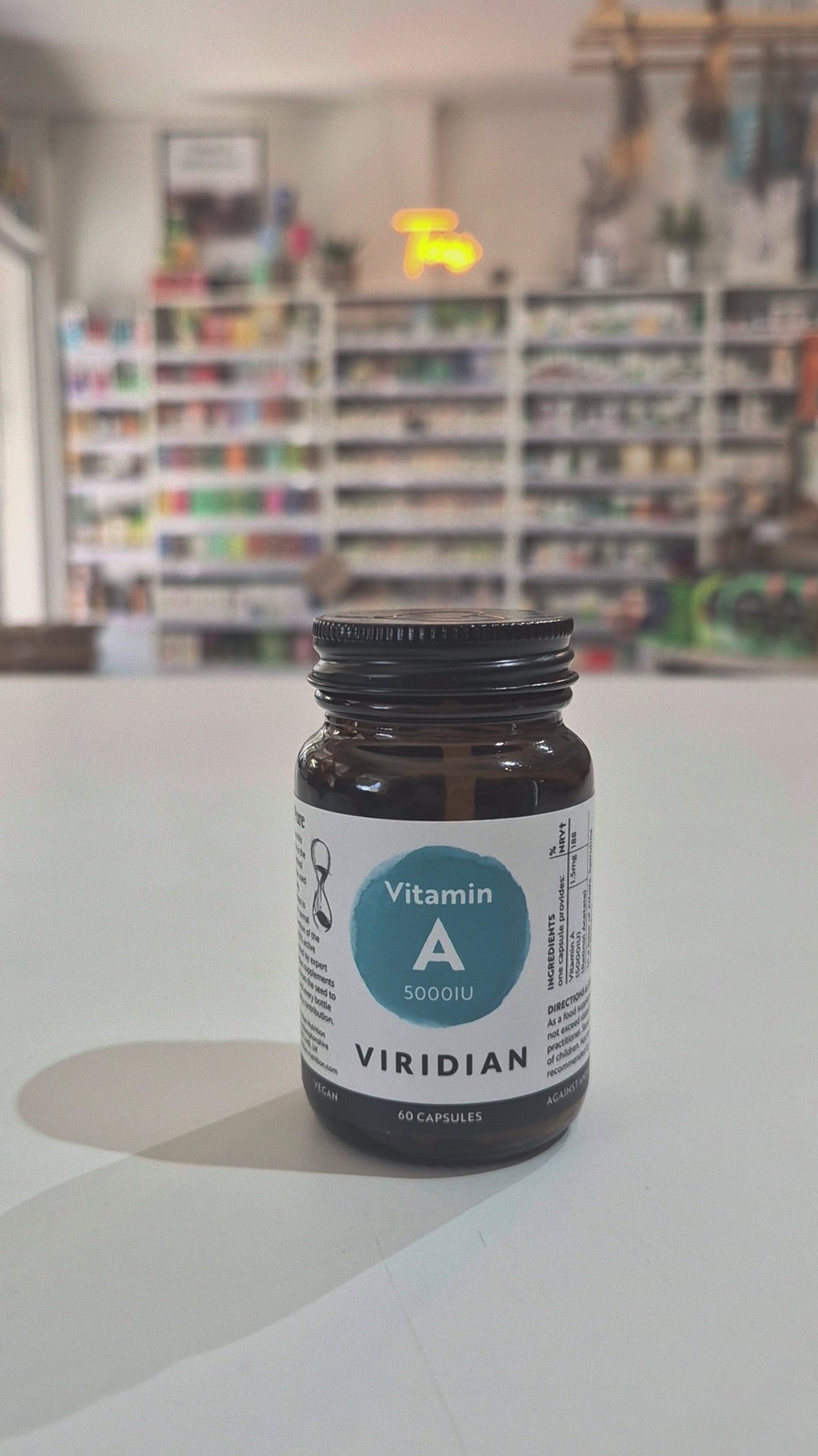 Brown supplement bottle labeled 'Clear Skin Complex' by Viridian on a white background video