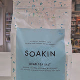 Package of Soakin Dead Sea Salt with branding and product description on a light speckled background video