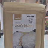 Organic Lion's Mane Mushroom powder on a white surface