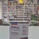 Box of Lamberts Silica Complete supplement on a counter with a store background Video