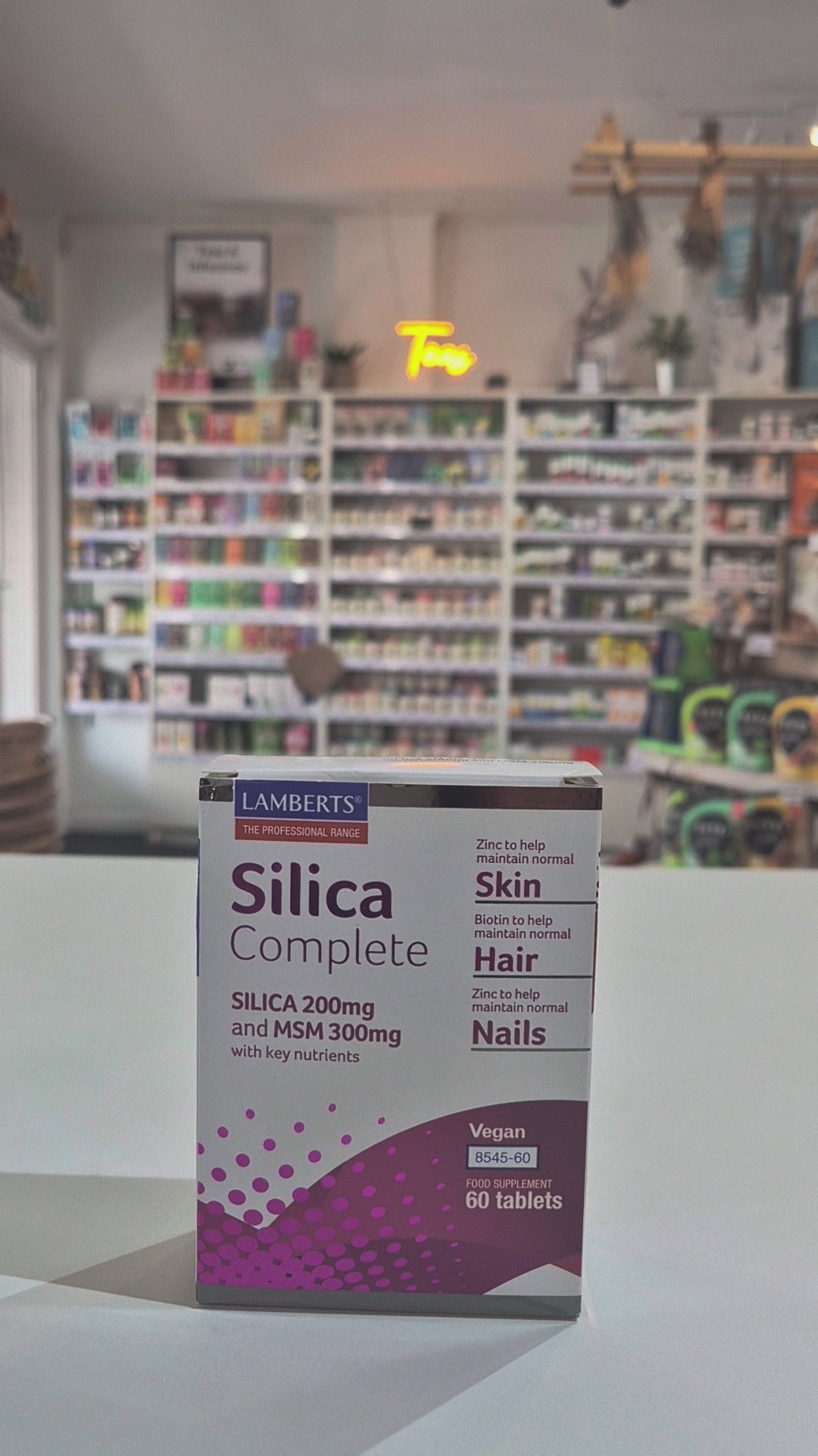 Box of Lamberts Silica Complete supplement on a counter with a store background Video
