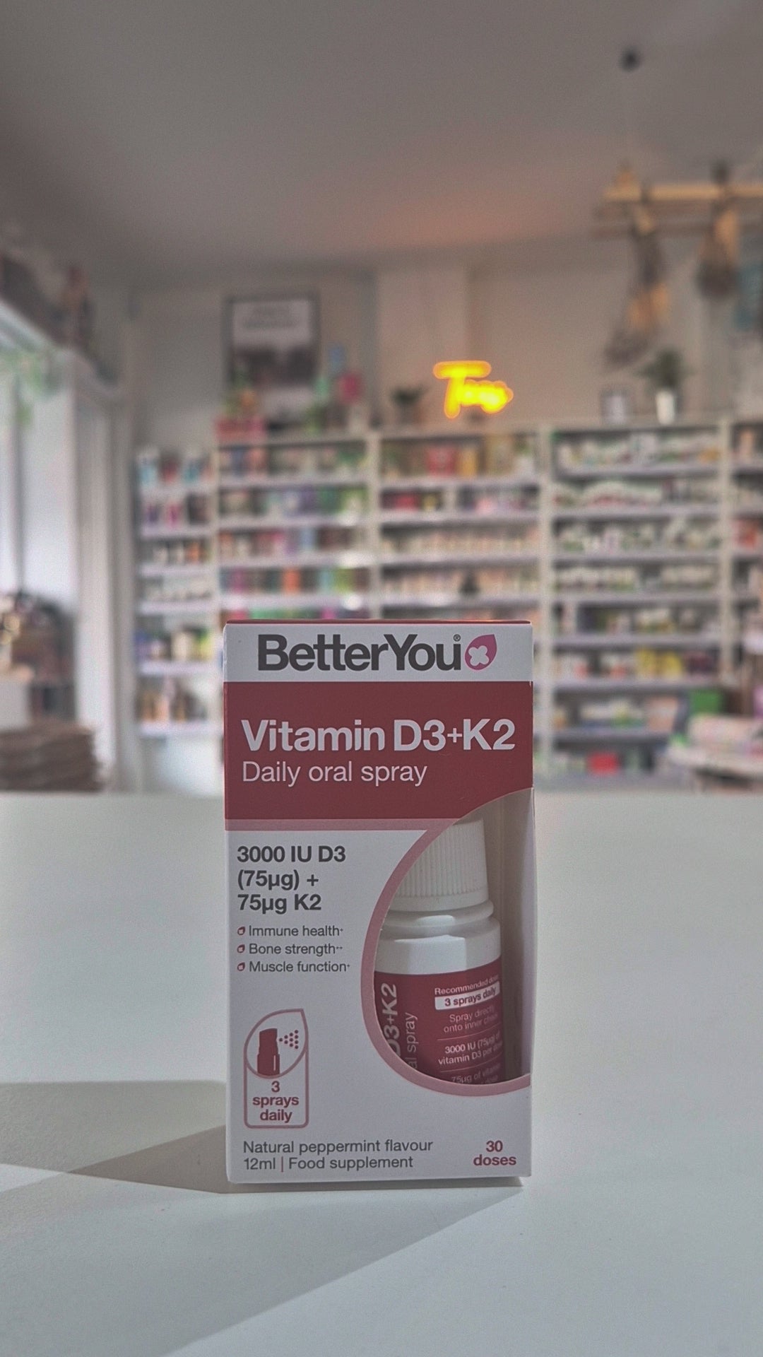 Betteryou Vitamin D+K2 Daily Oral Spray, displaying the product and its information in a shop setting video
