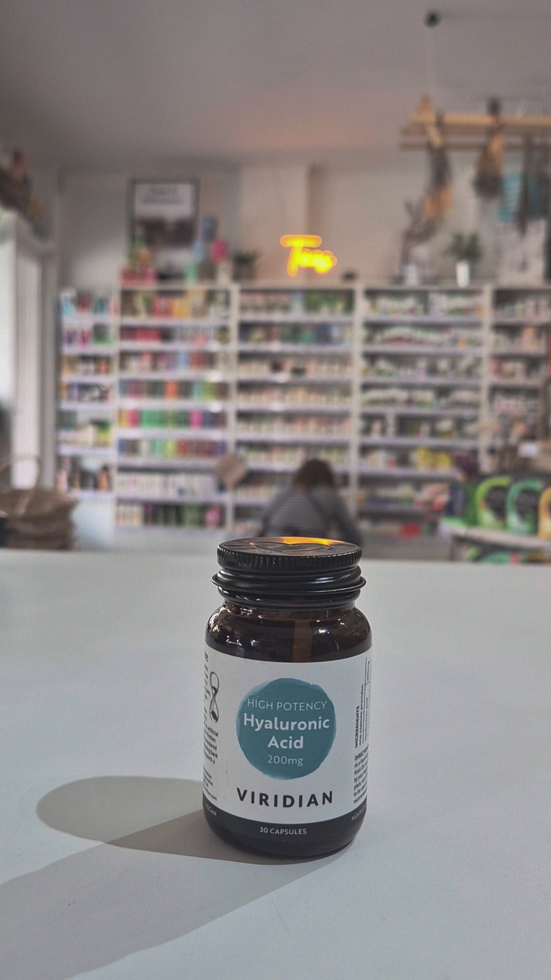 Bottle of Viridian Hyaluronic Acid on a counter in a store setting