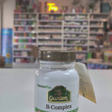 Nature's Plus B-Complex supplement bottle on a white surface with blurred store background video