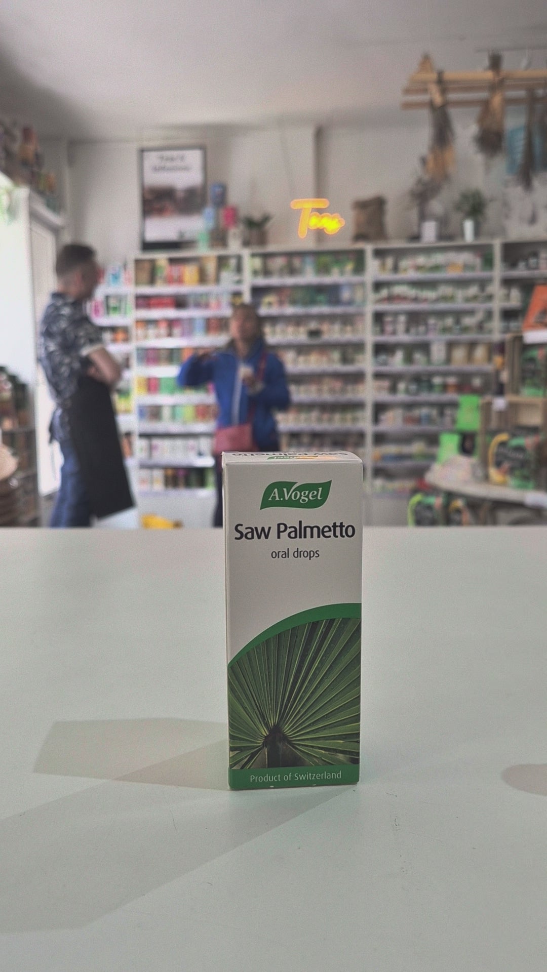 A.Vogel Saw Palmetto oral drops packaging on a counter with blurred store background