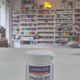 Lamberts Vitamin B12 supplement container on a table with a blurred background, in a shop setting video