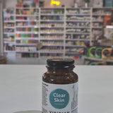 Brown supplement bottle labeled 'Clear Skin Complex' by Viridian on a white surface video