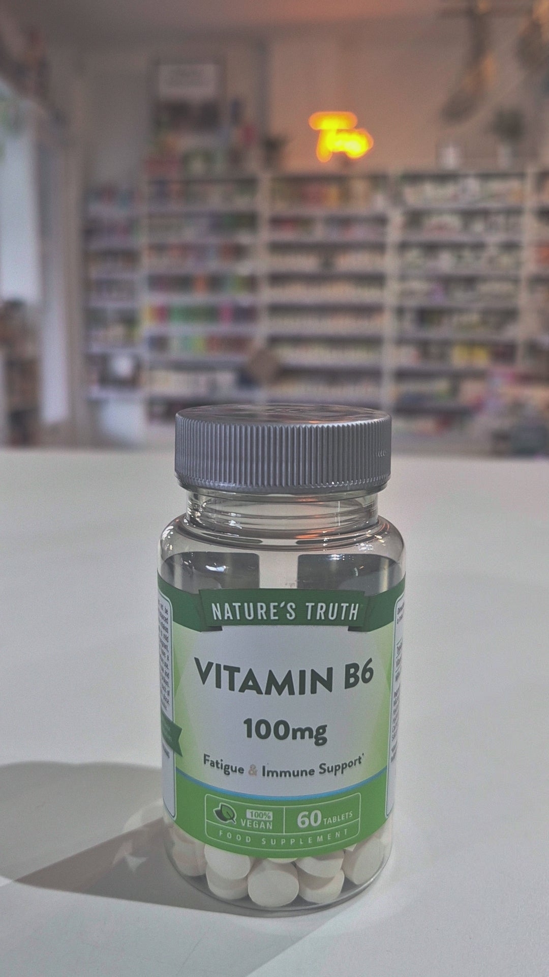Bottle of Nature's Truth Vitamin B6 100mg on a white surface