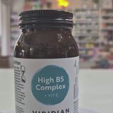 Jar of Viridian High B5 Complex supplement on a white surface with a blurred background