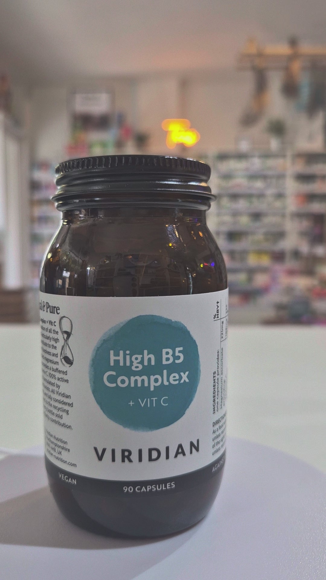 Jar of Viridian High B5 Complex supplement on a white surface with a blurred background