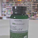 Bottle of NaturesPlus BioAdvanced Joint Complex on a table with a blurred store background