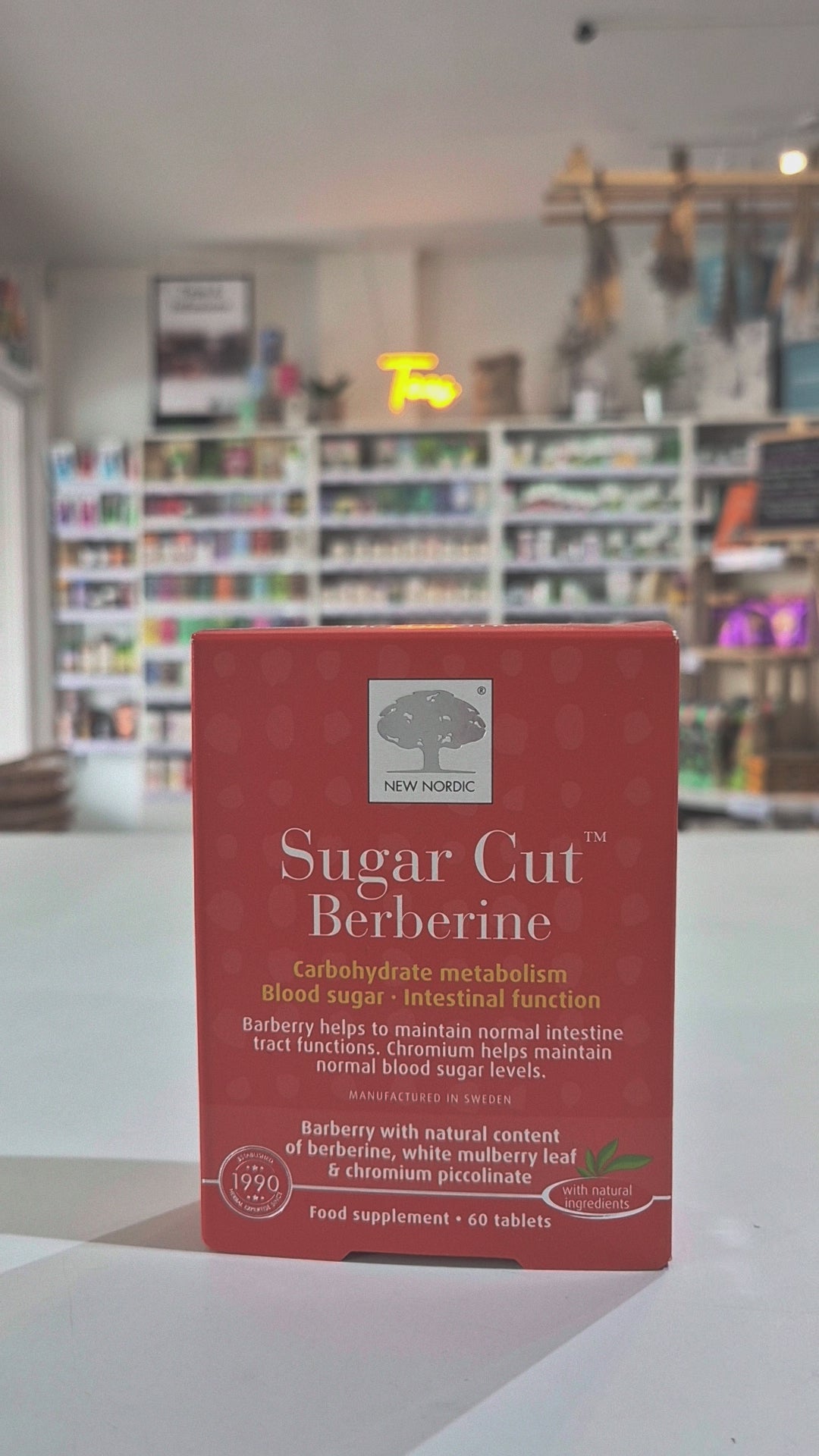 'Sugar Cut Berberine' held against a blurred bookstore background