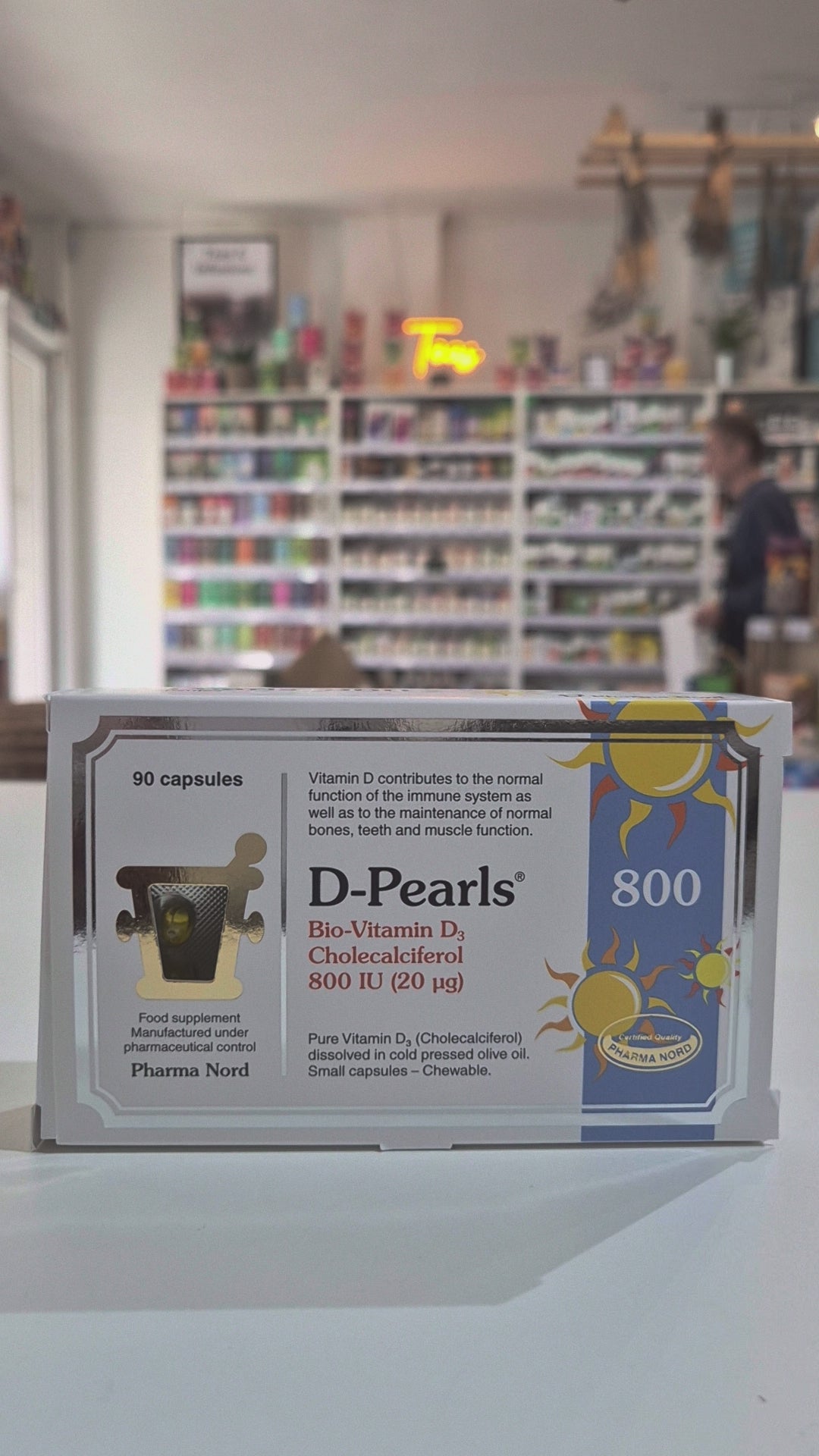 Box of D-Pearls Vitamin D supplement with sun design on a white background