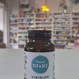 Vitamins D3 & K2 bottle with Viridian label on a shop background video