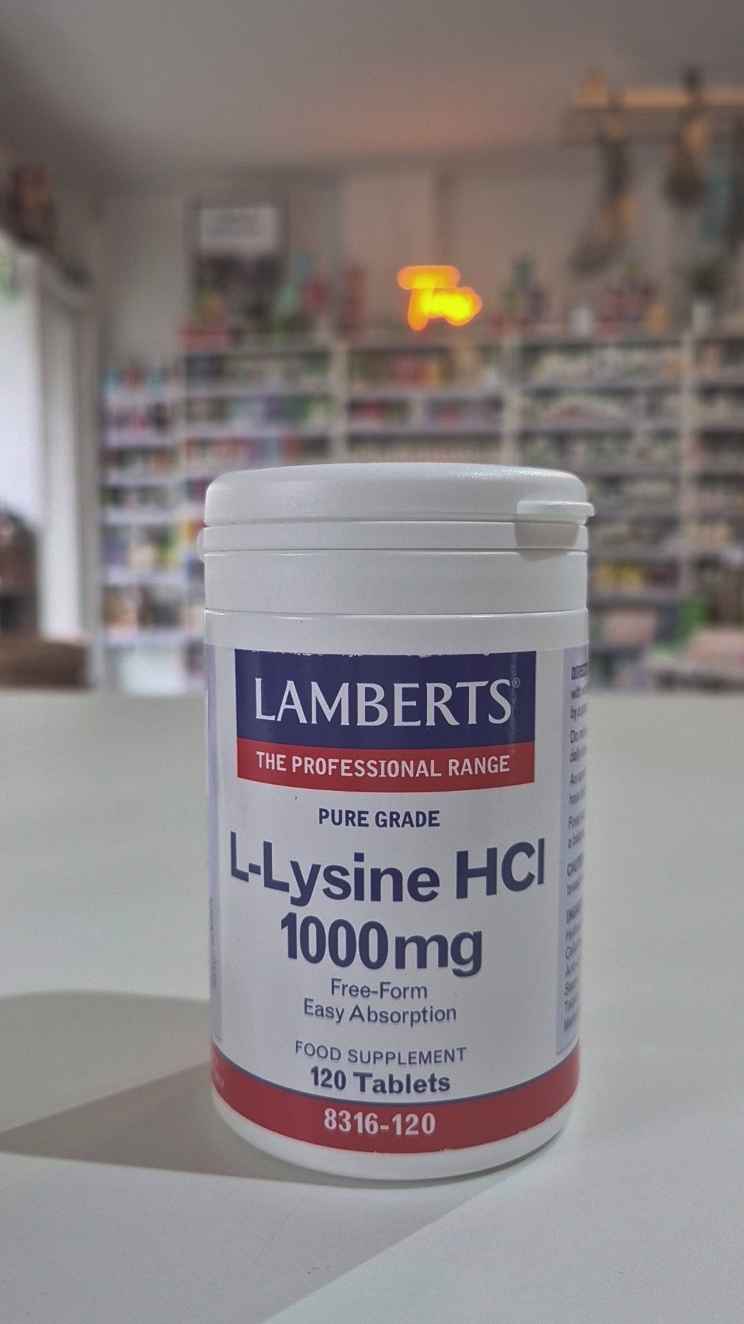 Lambert's L-Lysine HCI supplement bottle in a store setting