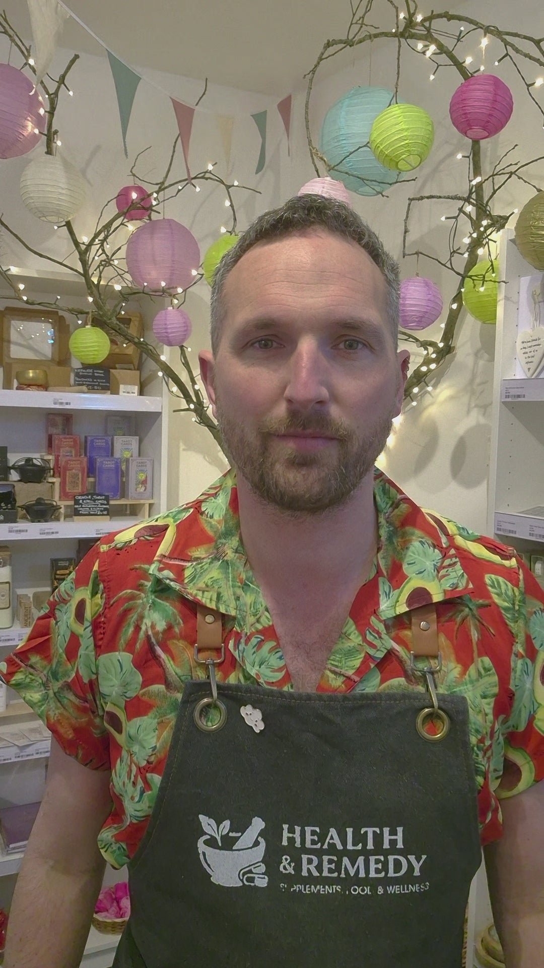 Green package of DJ&A Veggie Crisps with a bowl of colourful vegetables on a white background video eating