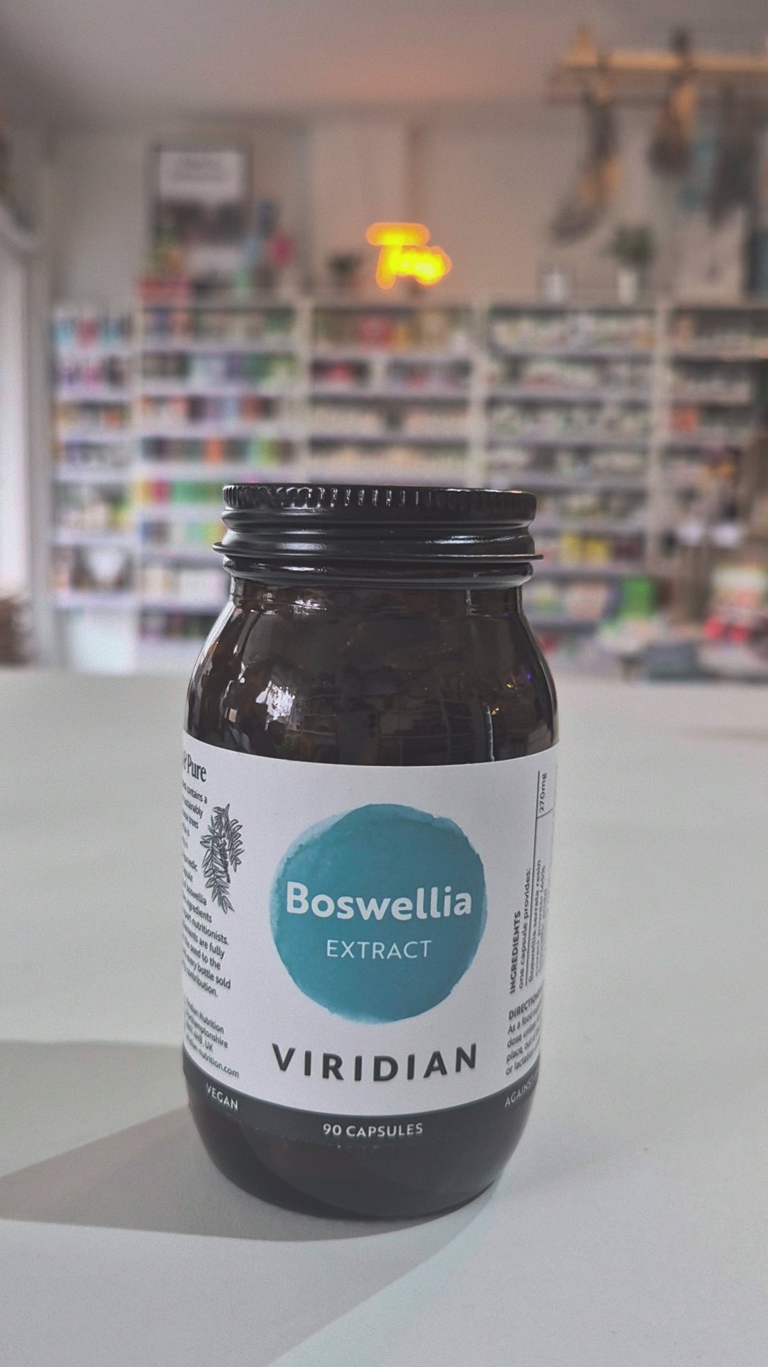 A bottle of Viridian Nutrition Boswellia Extract with 30 capsules, labeled in a clear and simple design primarily in white and blue colours in a shop video