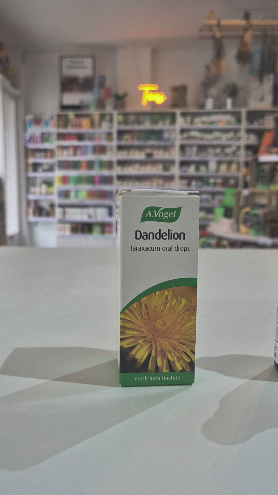 A box of A.Vogel Dandelion Taraxacum oral drops on a surface with a blurred store background video