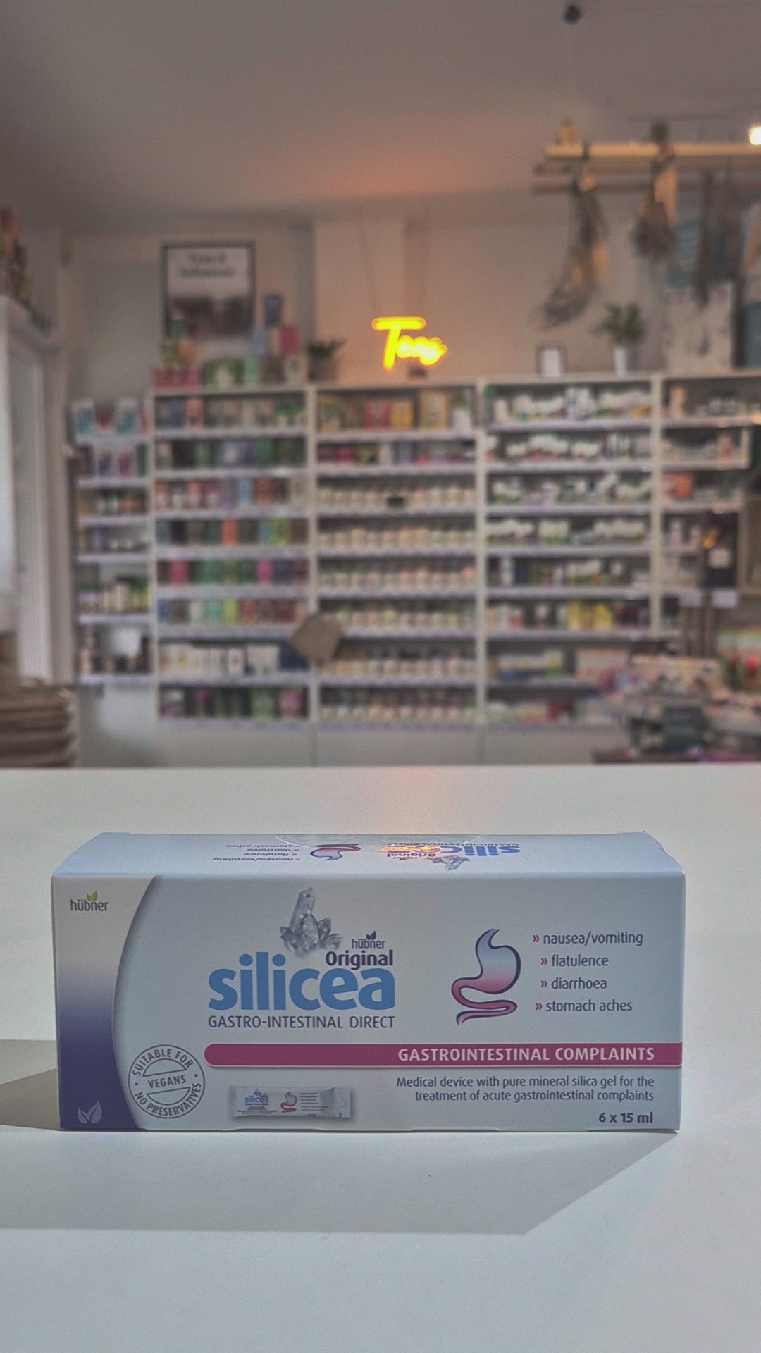 Box of silicea Gastrointestinal Direct on a counter with a blurred store background video