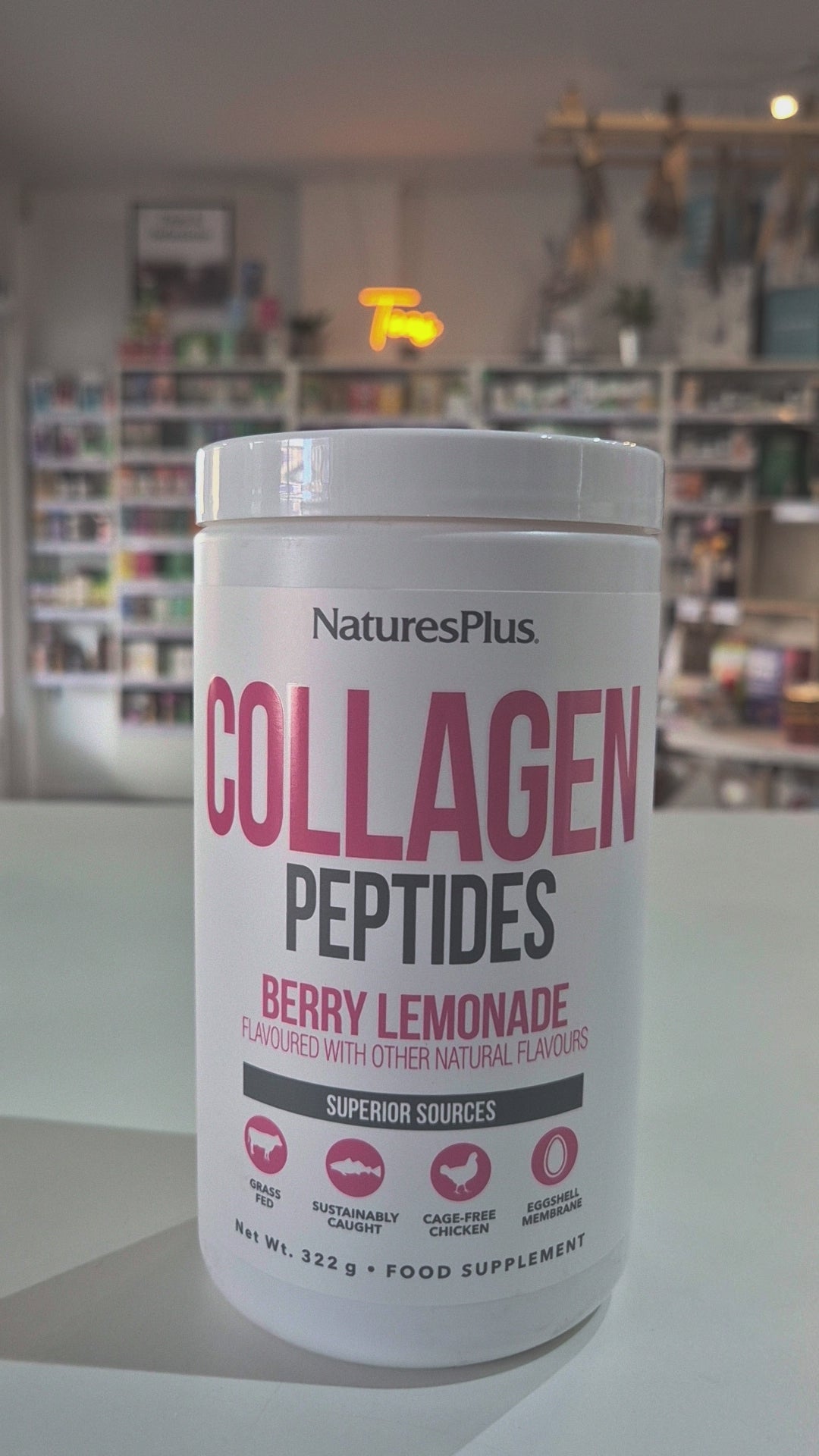 Nature's Plus Collagen Peptides in Berry Lemonade flavor, dietary supplement powder in a white container with pink and green text highlighting the product features Video
