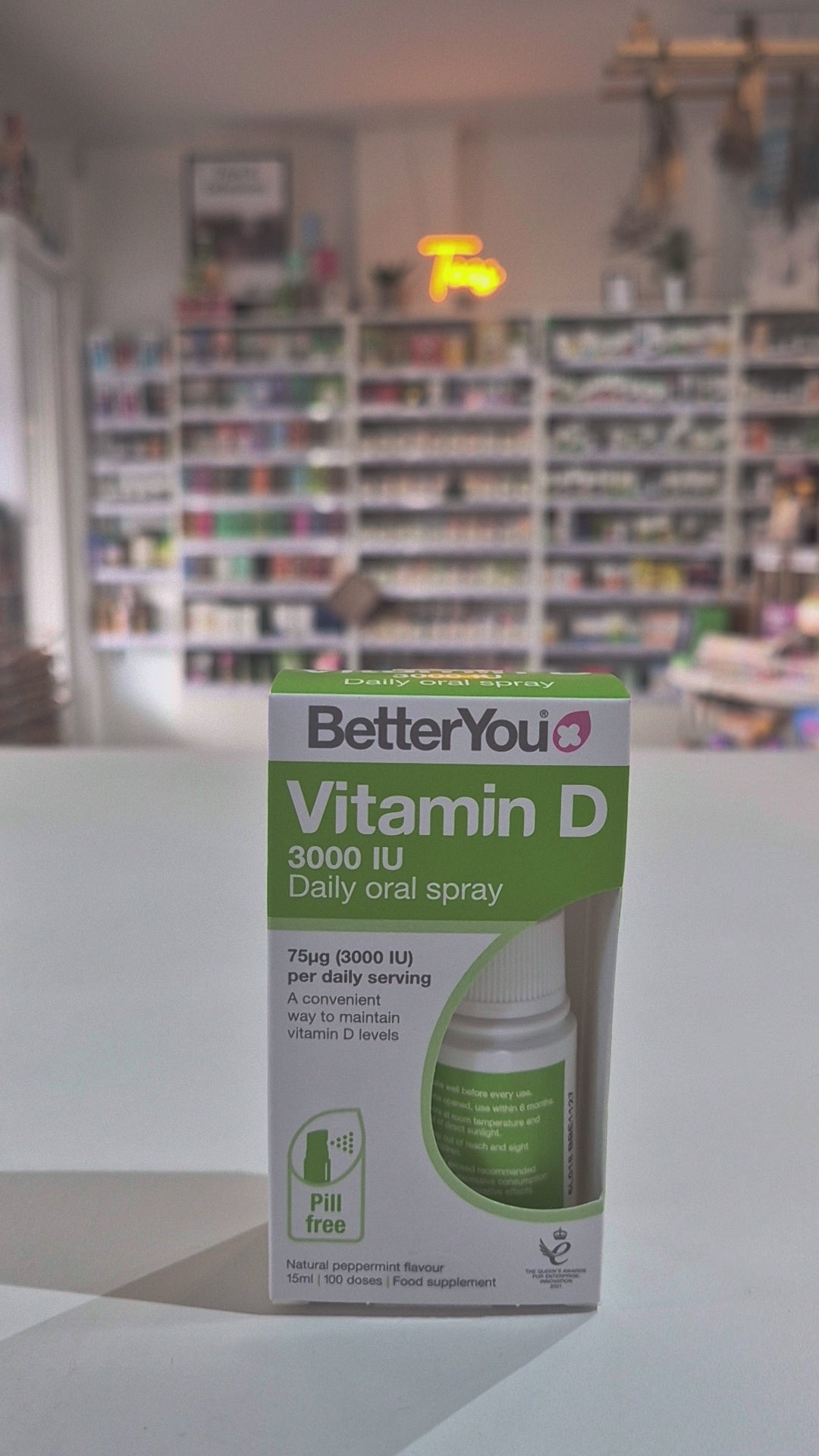 Packaging of Betteryou Dlux 3000 Daily Vitamin D Oral Spray with a green and white color scheme, indicating 3000 IU per spray in a shop video