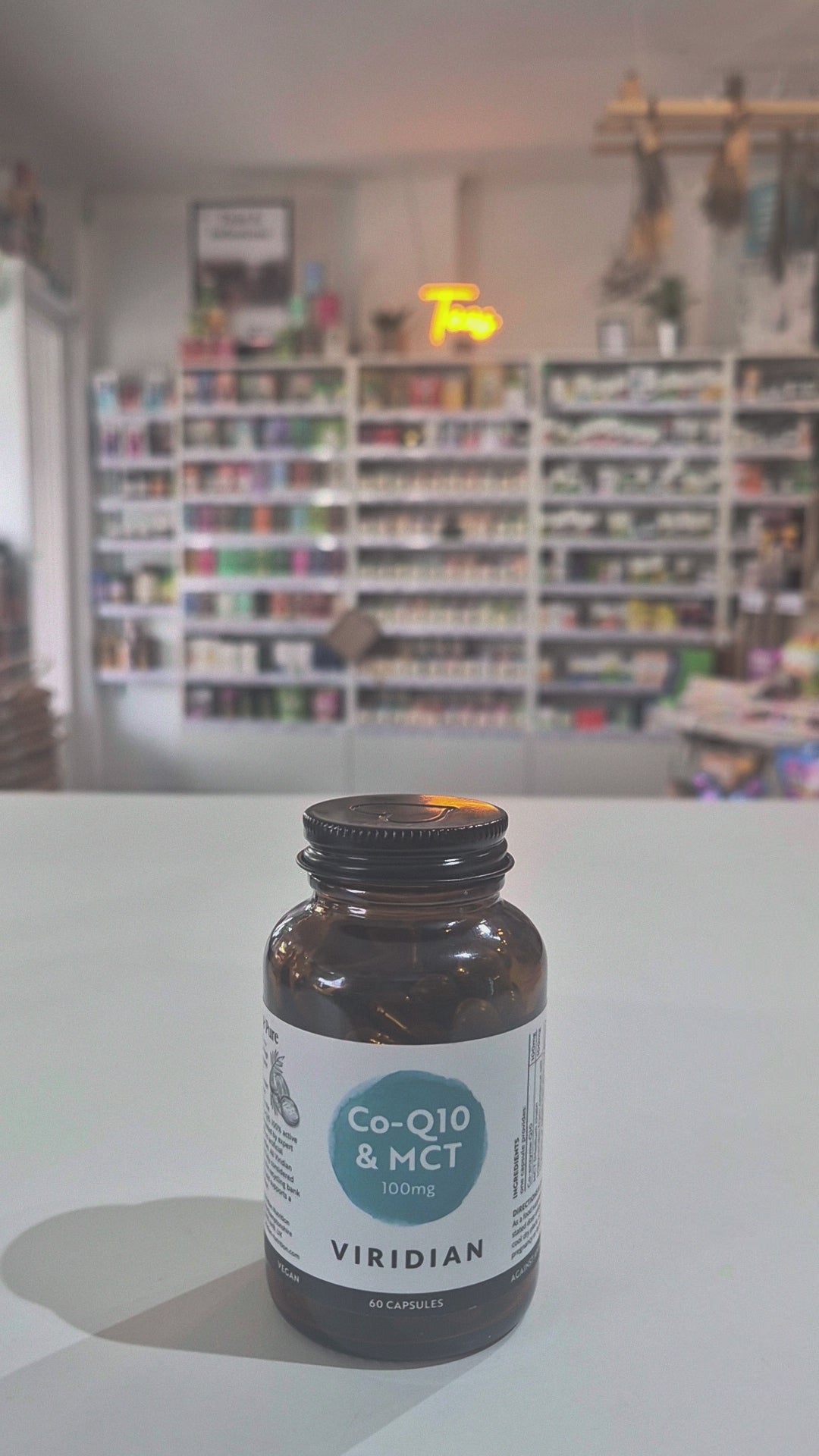 Bottle of Viridian Co-Q10 & MCT supplement on a shelf with a blurred store background Video