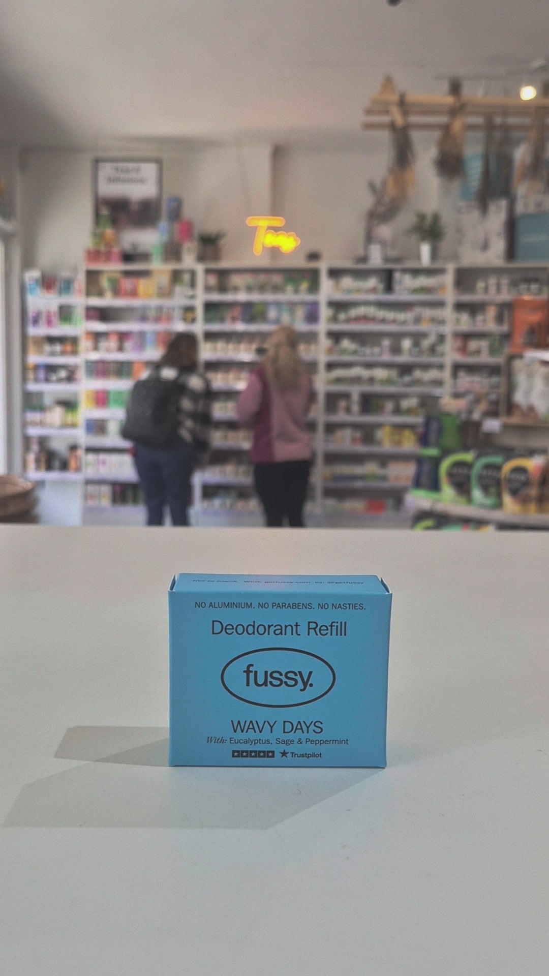 Fussy compostable deodorant refill packaging with a store in the background
