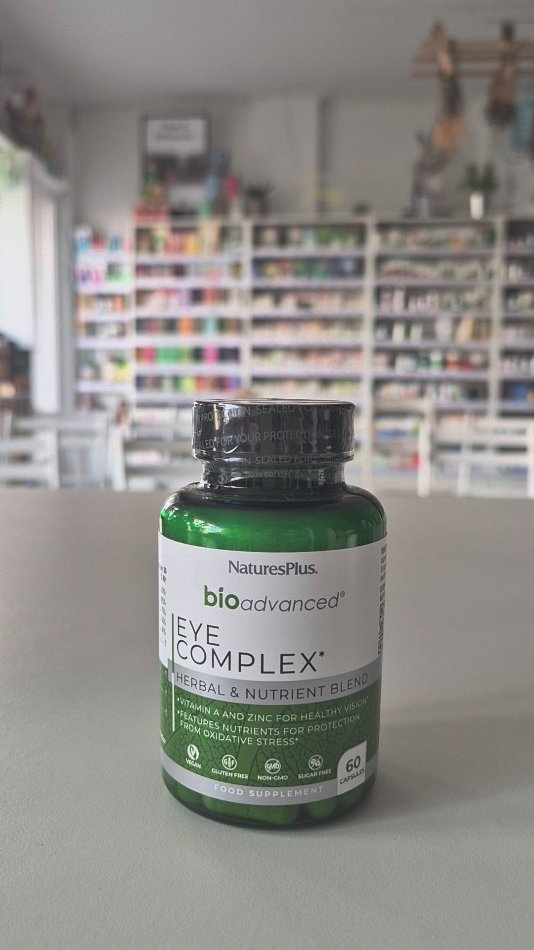 NaturesPlus bioadvanced Eye Complex bottle on a table with a blurred background video