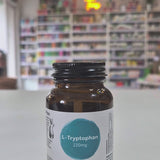 Bottle of Viridian L-Tryptophan on a shelf with a blurred store background