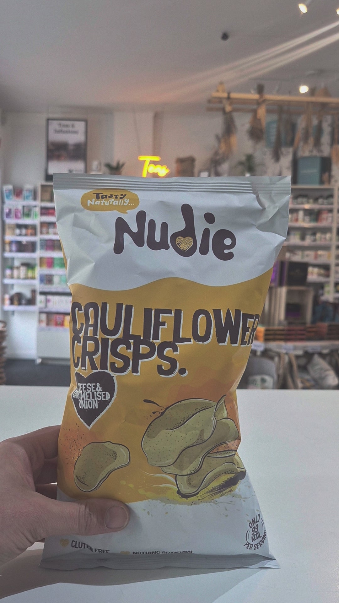 Nudie cheese and caramelised onion cauliflower crisps are gluten-free dairy free and only 99 calories per serving