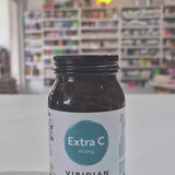 Bottle of Viridian Extra C supplement on a white surface with a blurred background in a shop as a video