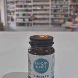 Viridian Co-Q10 & MCT supplement bottle on a white surface with a blurred store background