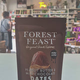Packaged snack with 'Forest Feast' branding on a counter in a store.