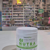 GI Nutra powder in a tub