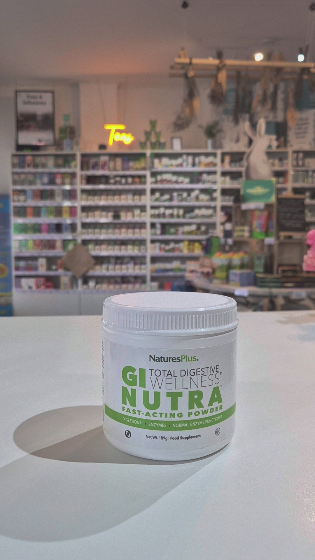 GI Nutra powder in a tub