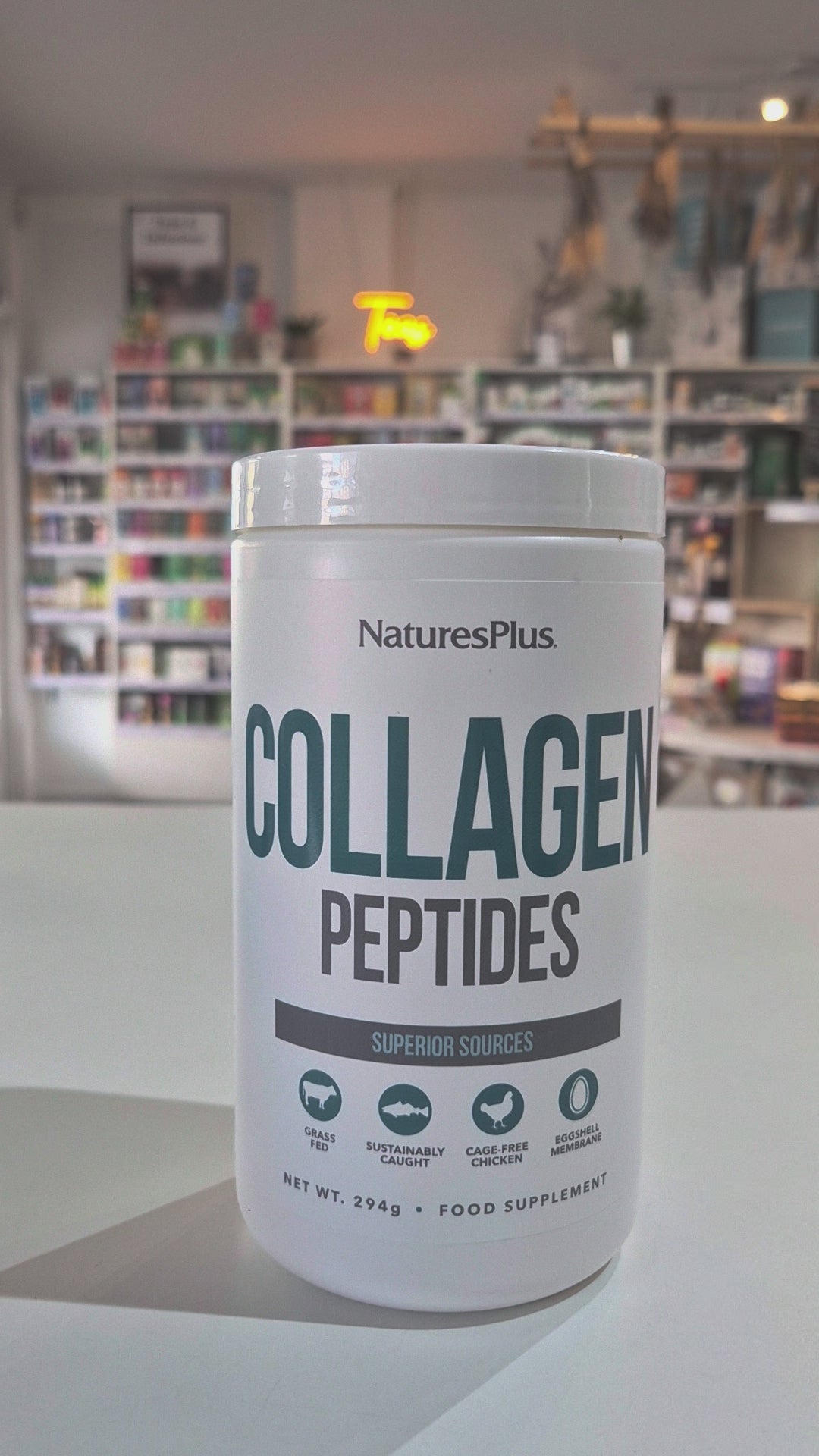Nature's Plus Collagen Peptides in a white container with a blue and green label, indicating the product is a food supplement, sourced from superior collagen-rich proteins, and weighs 280g video