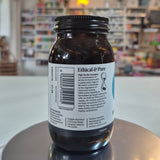 Jar of Viridian High Six B6 B Complex supplement on a counter with a blurred store background. Jars of 'Ethical & Pure' supplement on a counter with a blurred store background