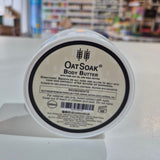 Oat Soak body butter container with label in a store setting