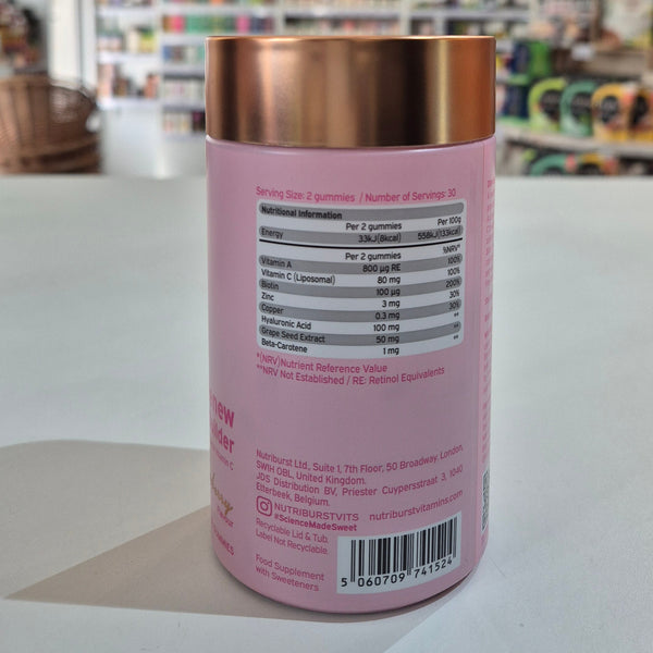 Pink supplement container with a copper lid on a white surface