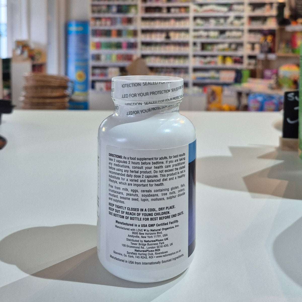 Supplement bottle with label on a store counter