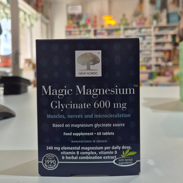 Box of New Nordic Magic Magnesium Glycinate 600 mg supplement on a blurred store shelf background