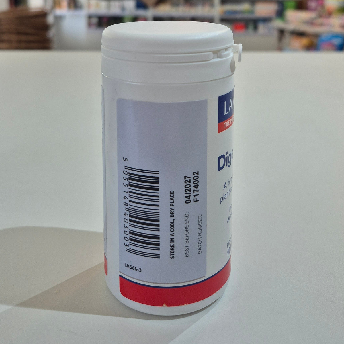 White container with a label on a white surface