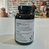 Supplement bottle with label on a counter in a store setting